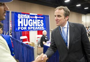 State Rep. Bryan Hughes shakes hands with a delegate at the trade show of the Texas Republican Convention June 8, 2012.