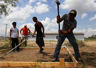 Juvenile detainees work on a new juvenile detention village in Eagle Pass. Maverick County has been taking donations for the new facility, which is being built, in part, by county employees who sacrifice their own time for the project.