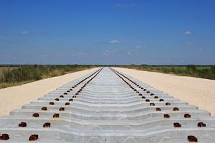Concrete railroad ties are staged for the construction of the new Brownsville rail bridge.