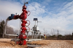 A pump at an Alvin, Texas oilfield uses carbon dioxide, piped in from Mississippi, to help extract oil.