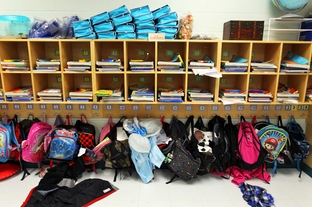 Alex Train's first grade classroom only had 22 students at the beginning of the year, but has added two more since at Wanke Elementary School in north San Antonio, Friday, March 9, 2012.