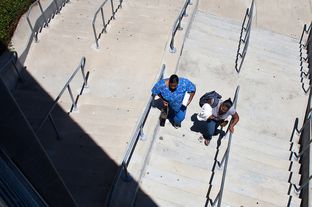 Students walking between buildings at Austin Community College - Eastview Campus.