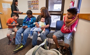 Rosario Espriella (center) waits for her appointment at the Edinburg, Texas Planned Parenthood clinic on Tuesday, February 14 with her children L to R: Edgar, 6, Eduardo, 12, Diego, 2 months and Victor, 10.