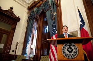 Gov. Rick Perry presents the Governor's Award for Historic Preservation to the Texas Parks and Wildlife Department Wildland Firefighting Teams for their work combating wildfires the state has faced in the past year.