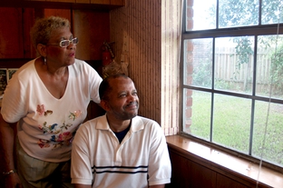 Scherry Levi with her mentally disabled nephew Deartis Preston in Preston's home in Bay City.