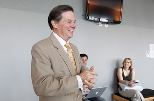 Former House Majority Leader Tom DeLay, R-Sugar Land, speaks with media at the 331st District Court of Travis County during the pretrial hearings on money laundering charges against the former congressman.