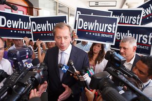 Lt. Gov. David Dewhurst talking with reporters while campaigning for U.S. Senate in Houston on July 31, 2012.