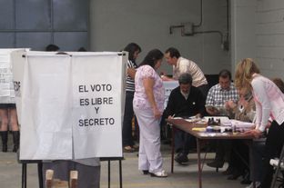 Voters line up to cast ballots in Mexico's presidential election Sunday at a voting sight on Popocatepetl street in Mexico City's Colonia Condesa.