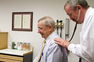 Capitol nurse practitioner Tim Flynn performs a routine check-up on state Rep. Warren Chisum on April 11, 2012.