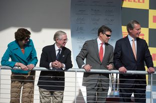 Awards stand of the Formula One Grand Prix in Austin, left to right, Comptroller Susan Combs, Nick Craw of FIA, Governor Rick Perry and Lt. Governor David Dewhurst.