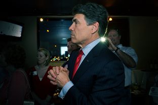 Gov. Rick Perry on May 29, 2012, watching television returns after speaking at the party for Charles Schwertner's victory in the Texas Senate race for District 5.