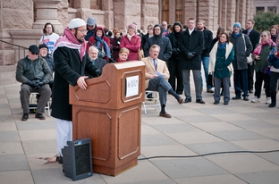 Imam Islam Mossad of the North Austin Muslim Community Center recites the Islamic call to prayer to start Texas Impact's interfaith prayer service on the capitol steps on the first day of session. Members of Christian, Muslim and Jewish faith traditions gathered to pray for legislators and to ask that they act as responsible shepherds for the people of Texas.