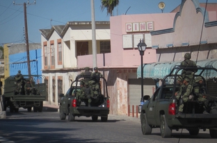 Soldiers ride on a street in Miguel Aleman, a city in the Mexican state of Tamaulipas, in 2010.