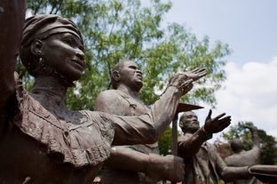 Statues built as a tribute to Juneteenth for the Texas Capitol grounds sit weathering at the Deep In The Heart of Texas Art Foundry property.
