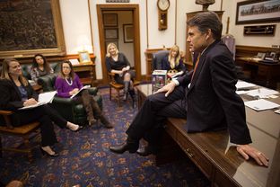 Gov. Rick Perry meets with senior staff members at his office in the state Capitol on Jan. 9, 2013.
