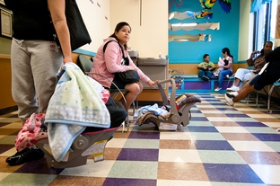 Patients wait to be seen at the People's Community Clinic in Austin, on Nov. 8, 2010. Founded in 1970, the People's Community Clinic is a primary care center for the medically under served and uninsured.