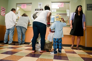 Patients are shown checking out in 2010 at the People's Community Clinic in Austin, a safety-net clinic that serves Medicaid recipients and the underinsured.