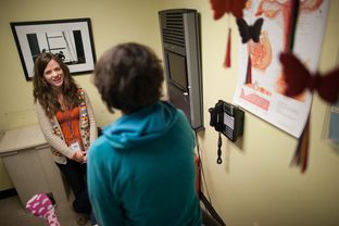 Nicole Griffis, nurse practitioner, consults with a patient at a Planned Parenthood clinic in Austin, Texas.