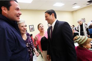 State Representative Trey Martinez-Fischer, right, and District 7 Councilman Justin Rodriguez, left, greet Rodriguez's grandmother, Inez Randon Ramirez, and her friend, Mary Barker as they get out the message to vote at the Alicia Trevino Lopez Senior Center in San Antonio, Friday, October 26, 2012.