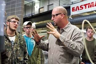 Students listen to their instructor, Curtis Collins, during their Pumps, Compressors and Mechanical Drives class at Texas State Technical College Waco.
