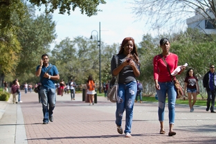 Texas Southern University students Chassity Piece (center) and Briana Falls (right) walk to class on Feb. 22, 2012.