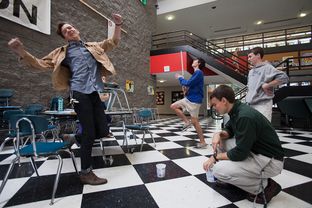 At Houston's High School for the Performing and Visual Arts, Keenan Hurley (left), 18, and Roby Attal, 17, react to missing their target during a physics lesson on projectile motion that used Hot Wheels cars.