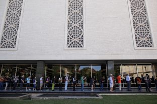 Voters wait in line to cast their ballots at the Flawn Academic Center on the University of Texas at Austin campus on Tuesday, Nov. 6, 2012 in Austin, Texas.