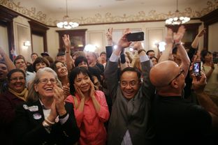 Democratic supporters at the Driskill Hotel in Austin erupt in celebration as CNN projects President Obama's re-election victory on Nov. 6, 2012.