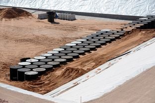 Modular concrete canisters containing nuclear waste are shown at the bottom of a storage pit near Andrews, Texas.