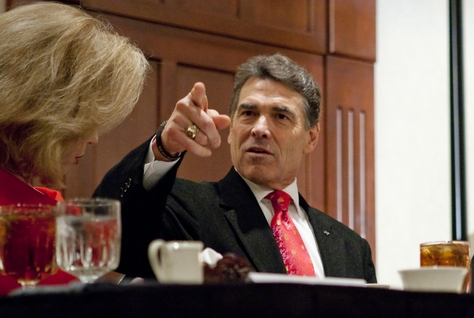 Gov. Rick Perry with wife Anita at a Williamson County Republican dinner in Round Rock, his first public appearance since leaving the presidential race.