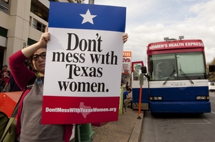 Planned Parenthood’s “Don’t Mess with Texas Women” tour bus made a stop near the University of Texas in Austin on Tuesday afternoon. The organization hopes to raise awareness of cuts to women’s health programs that it blames on Texas Gov. Rick Perry. Planned Parenthood’s Texas clinics will lose funding on March 14 from the Texas’ Medicaid Women’s Health Program, which serves some 130,000 low-income women.