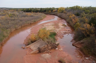 Collapsed bridge structure on the Double Mountain Fork Brazos River viewed from U.S. Route 83 at Rath City, Texas.