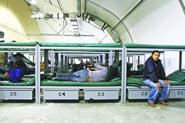 Detainees and bunk beds inside the Willacy Immigration Detention Center. 