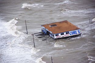 Joint Task Force-129 crew, Jolly 92, flies over the storm surge that overtook the Bolivar Peninsula bridge near Galveston, Texas, Sept. 12, 2008.