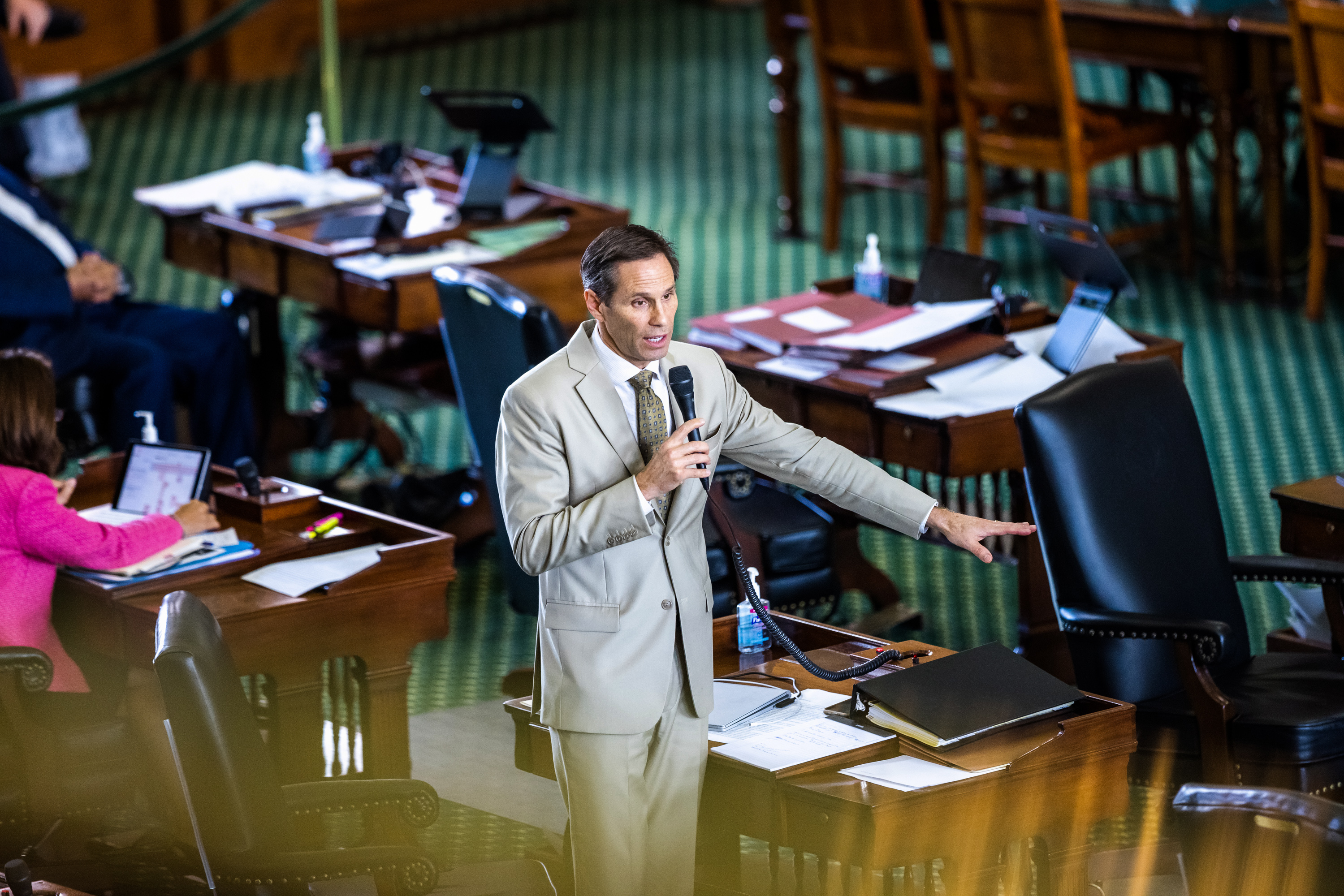 State Sen. Nathan Johnson, D-Dallas, speaks from his desk on the Senate floor on Wednesday, August 11, 2021.