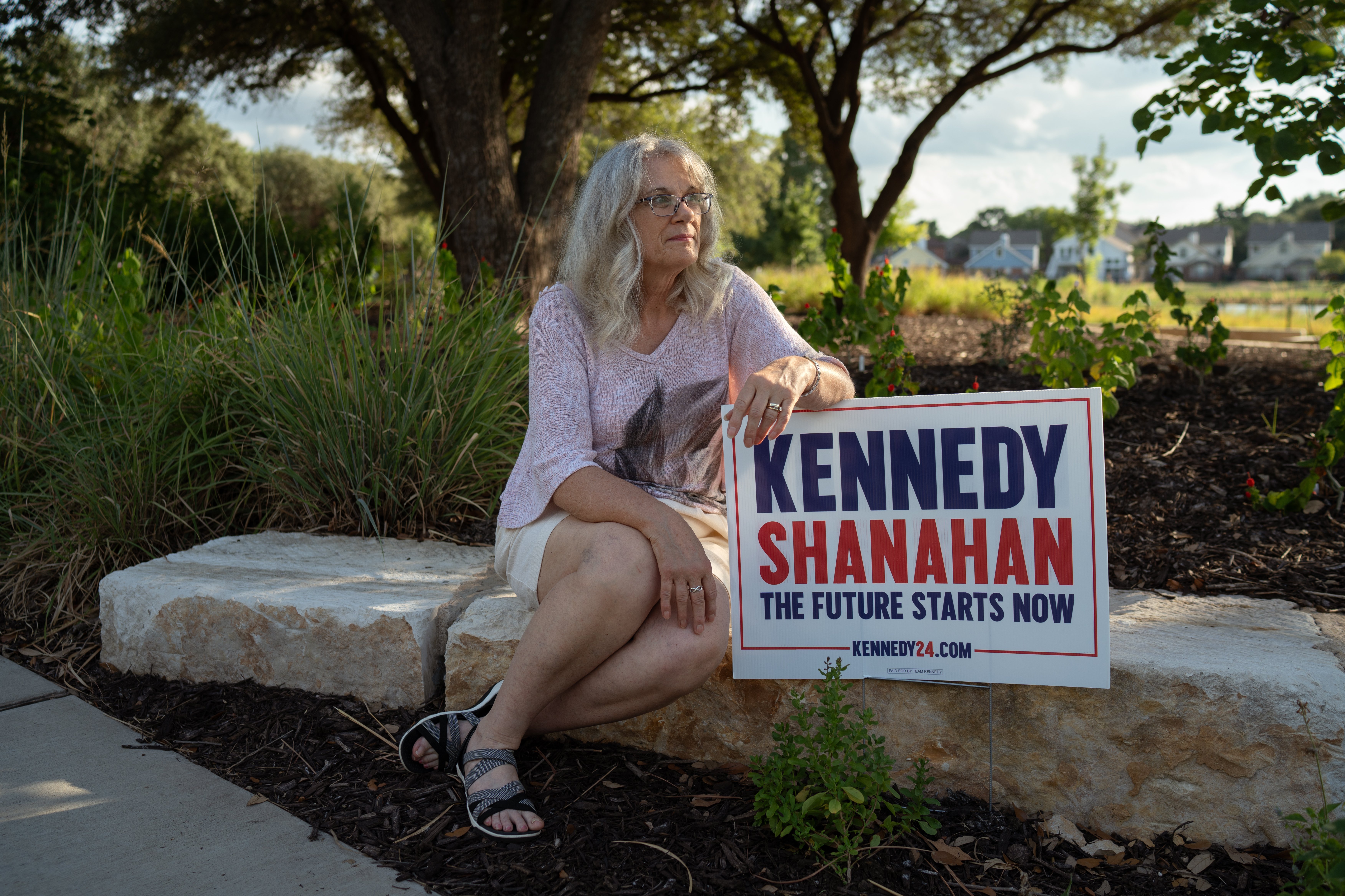 Diane Wright poses for a portrait with her RFK Jr. sign at Rheudasil Park in Flowermound, Texas.