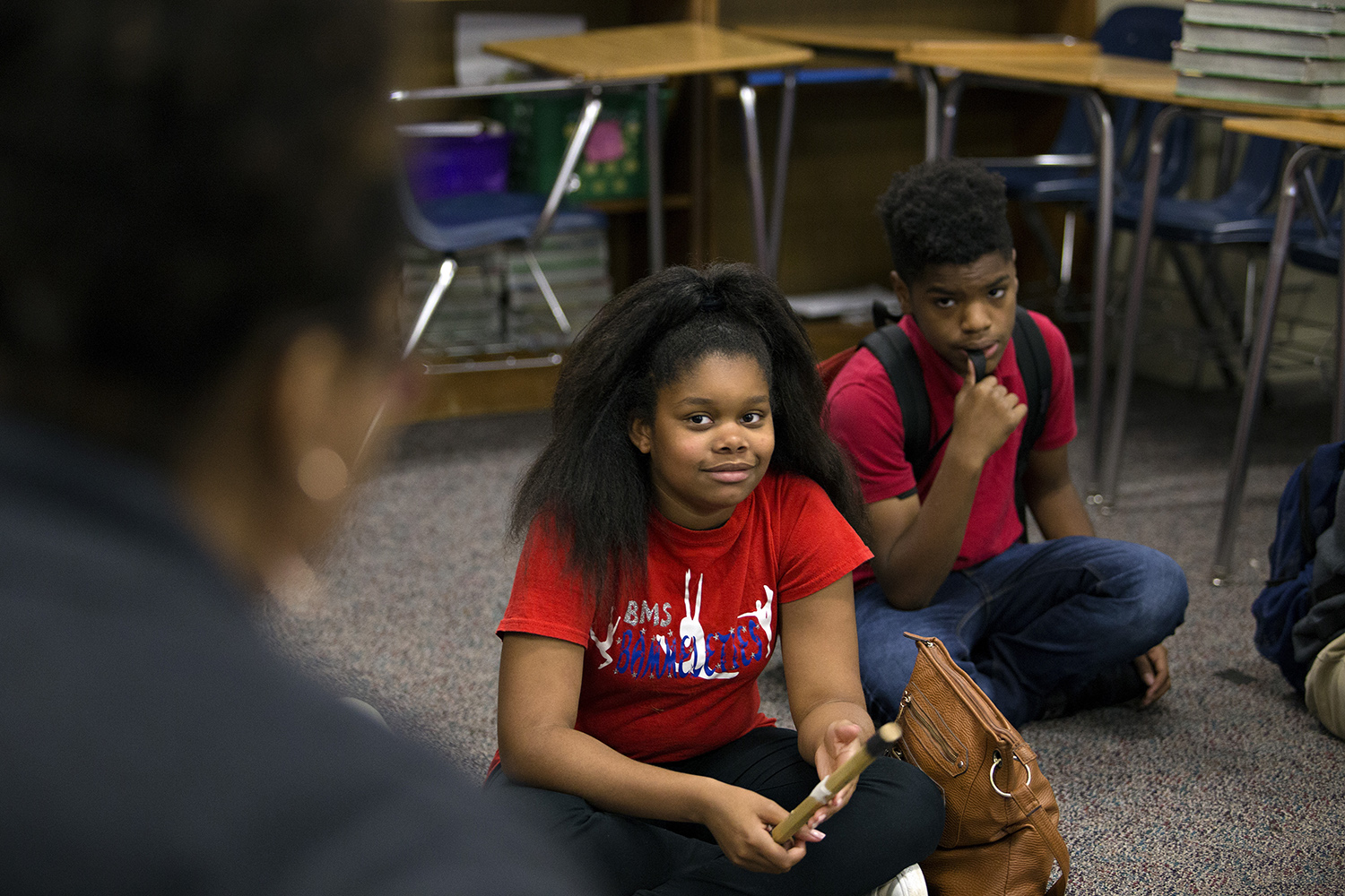 A student at Bammel Middle School receives the talking piece and listens to her teacher give the prompt in the restorative circle on April 20, 2018.