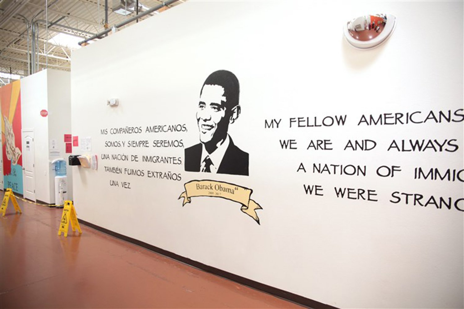 The mural of President Barack Obama in the Casa Padre immigrant shelter in Brownsville, located in a store that was previously a Walmart.