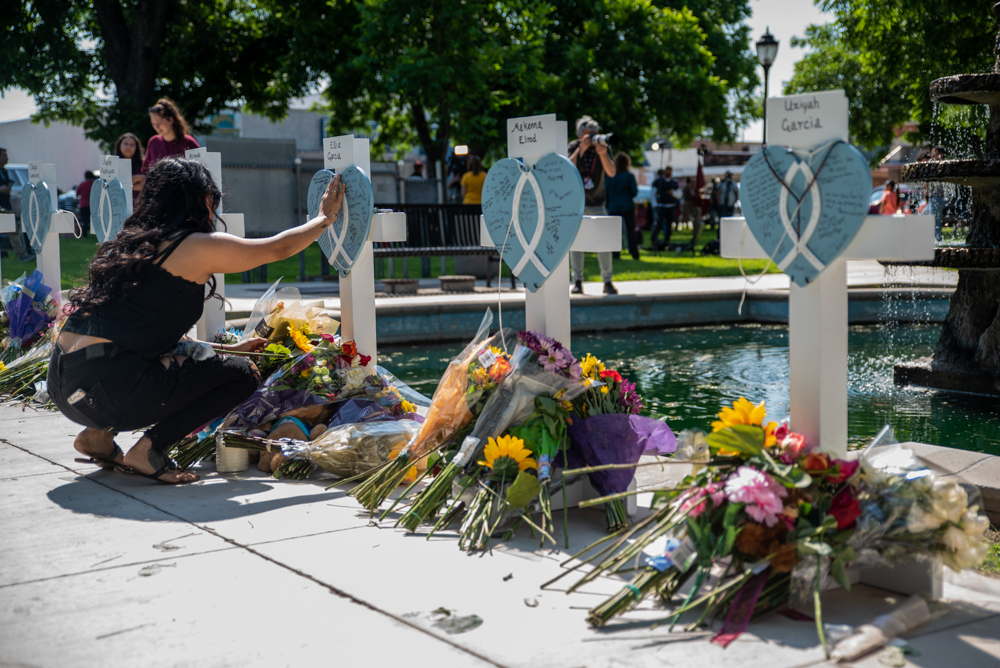 A woman grieves for victims of the mass shooting at a memorial site in the Uvalde town square on Thursday.