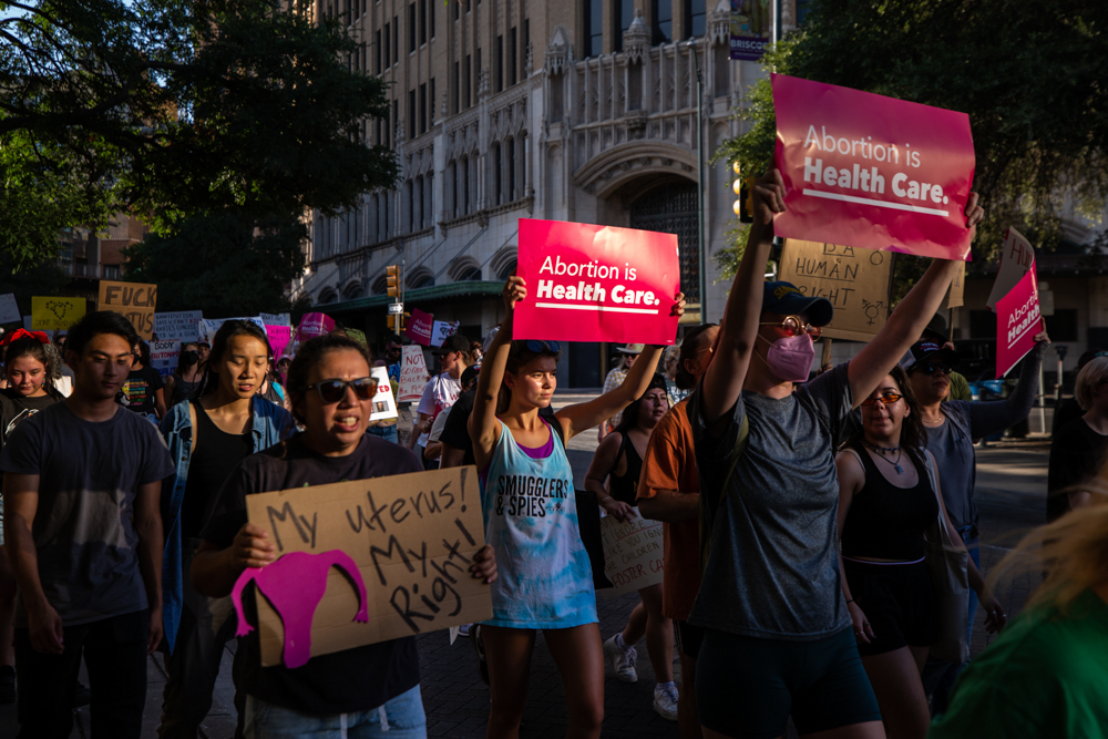 Thousands of people walk in support of abortion access in downtown San Antonio on Friday. (Kaylee Greenlee Beal for The Texas Tribune)