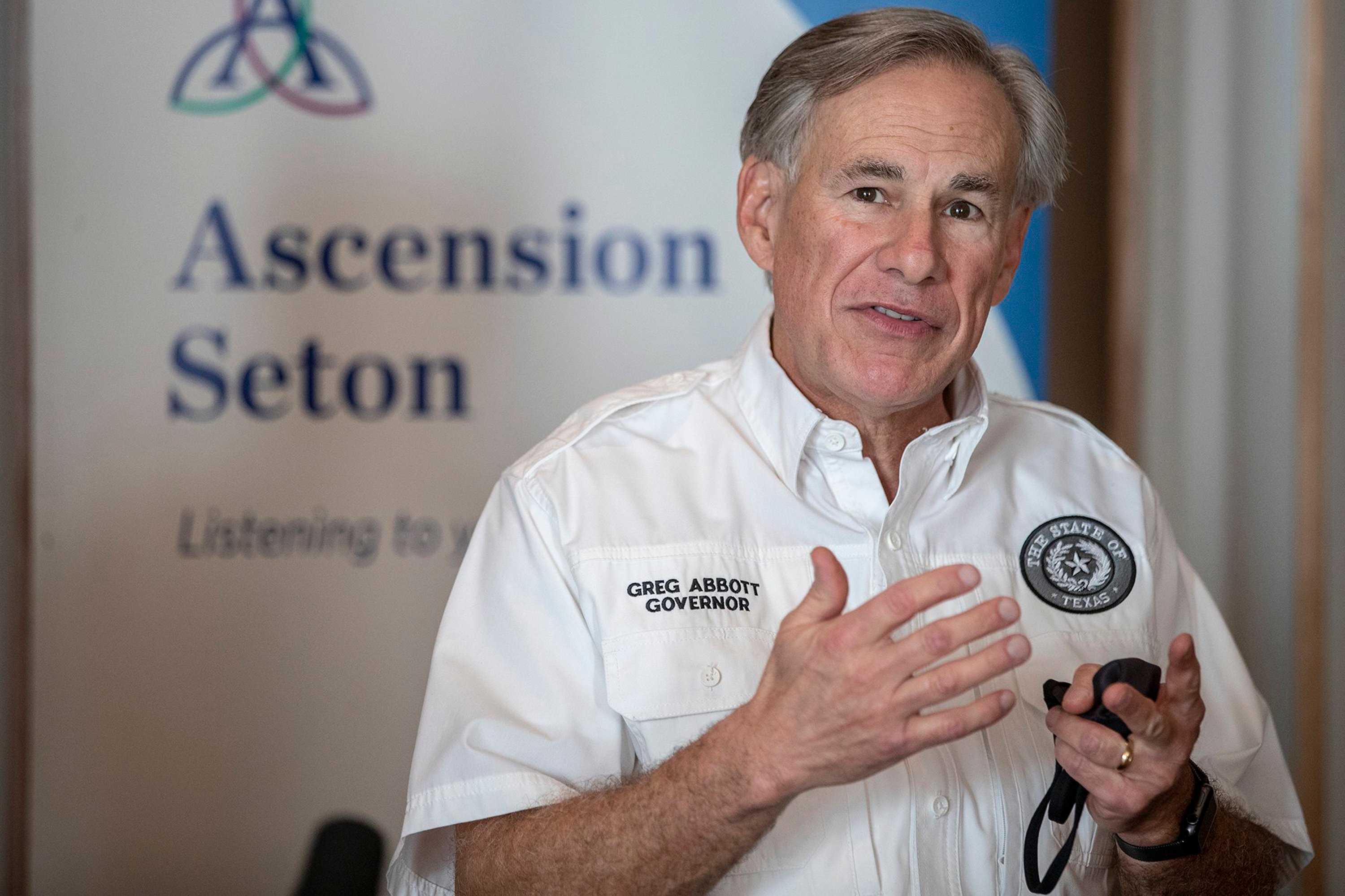 Gov. Greg Abbott speaks to local media before receiving a dose of the Pfizer-BioNtech COVID-19 vaccine at Ascension Seton Medical Center on Dec. 22, 2020, in Austin.