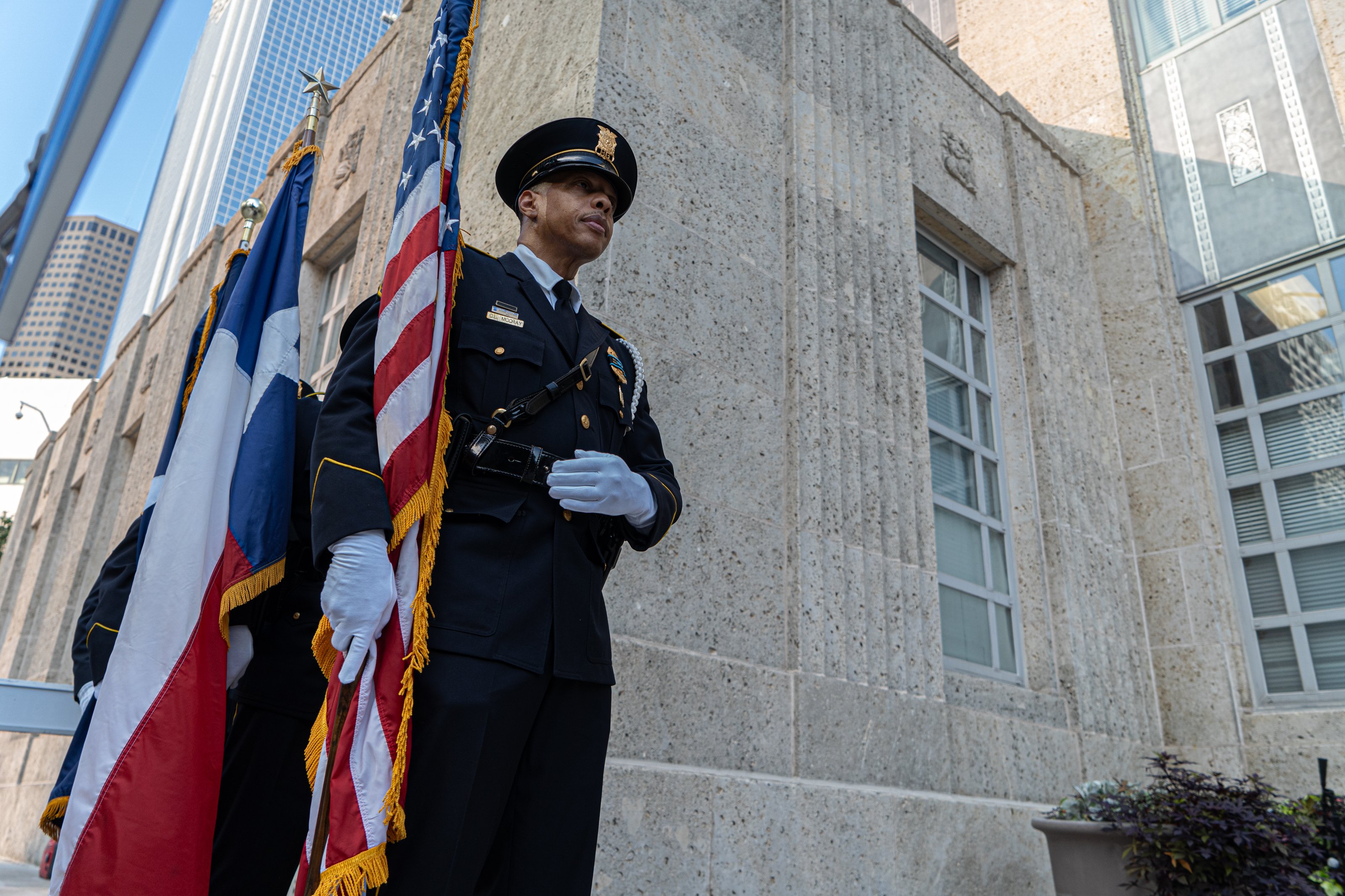 HPD Color Guard member Corey McCray await their cue to present colors to late congresswoman Sheila Jackson Lee who is laid in state in Houston’s City Hall, Monday, July 29, 2024, in Houston. (Douglas Sweet Jr. for Texas Tribune)