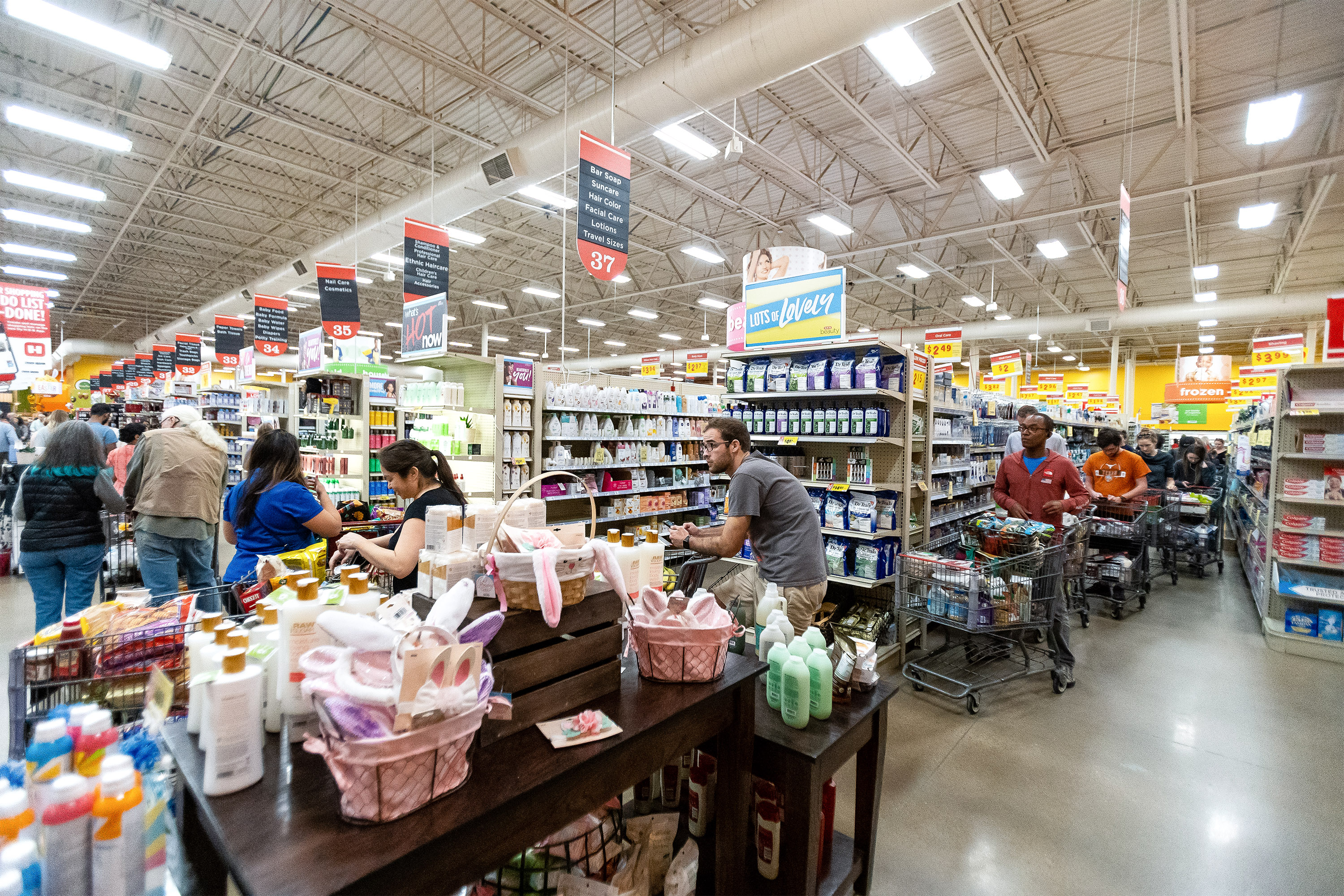 A long line forms at an H-E-B grocery store in Austin on March 13, 2020.