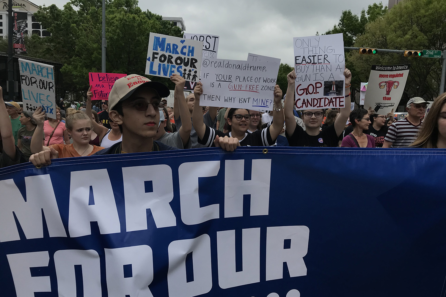 Ani Naser holds a March For Our Lives sign as the crowd marches from city hall to the state Capitol in Austin on Saturday.