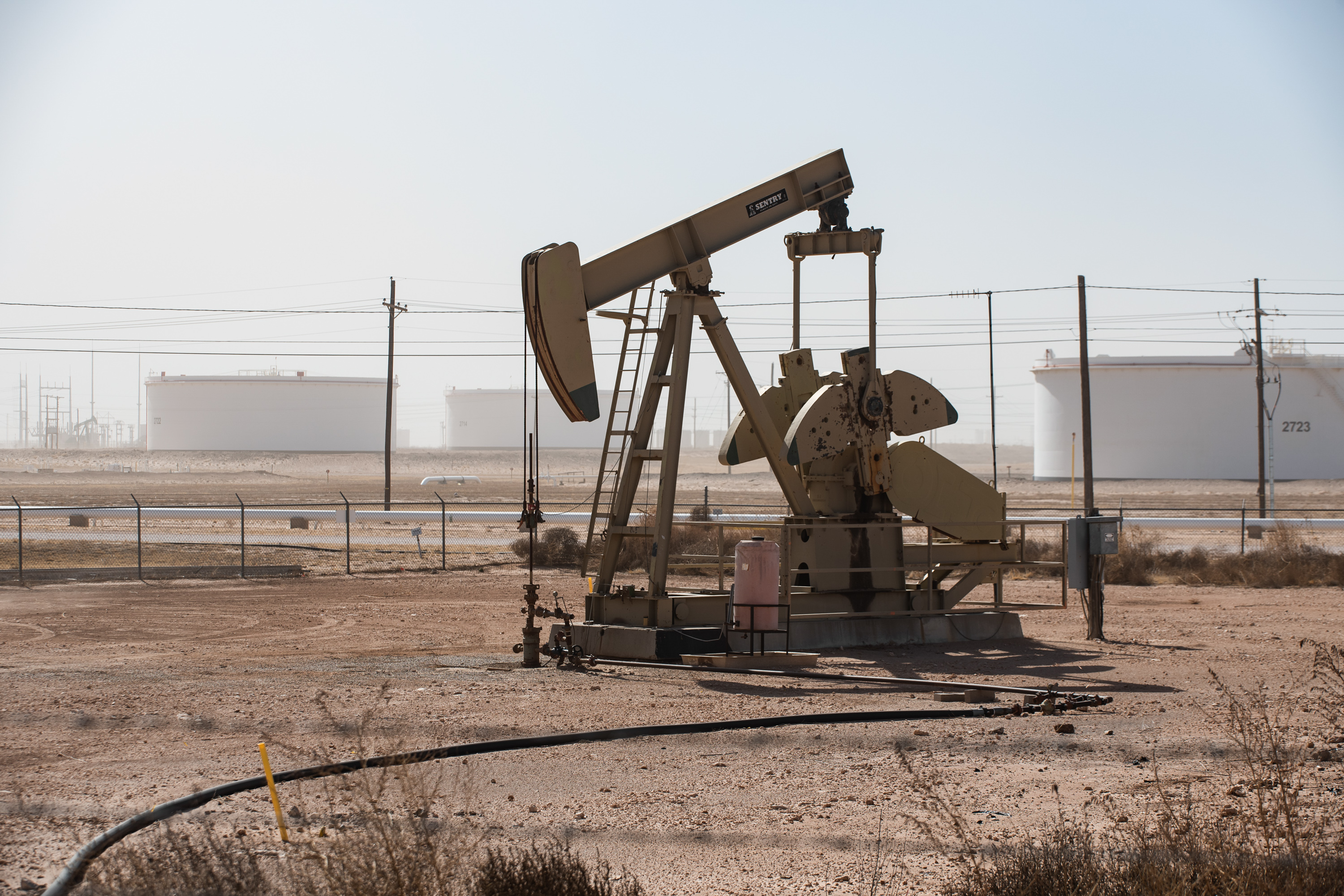 A pumpjack operates near a crude oil reserve on March 14, 2022 outside Midland, as rising gas prices begin to affect the Permian Basin.