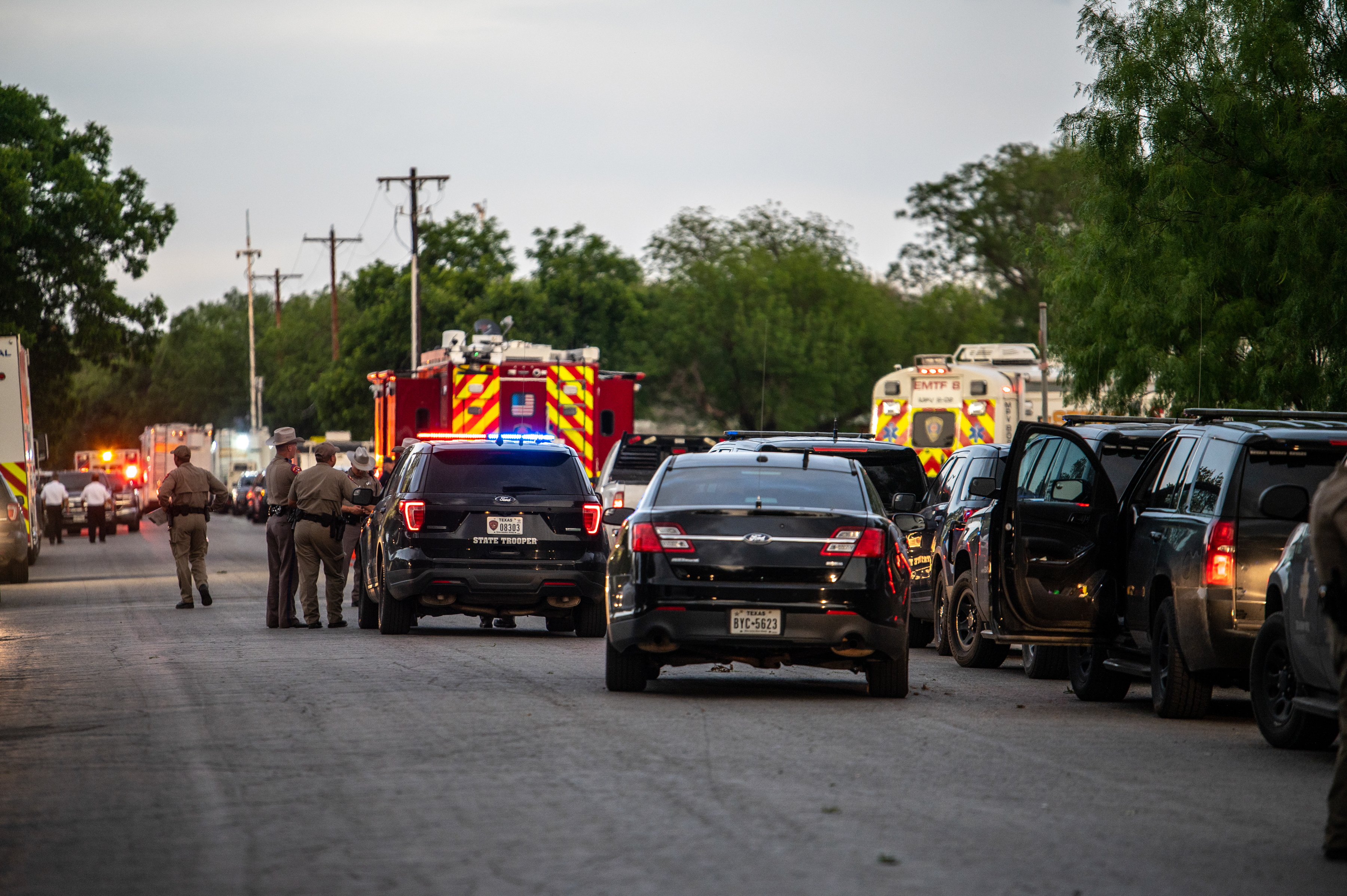Police block off the road leading to the scene of a school shooting at Robb Elementary on May 24, 2022, in Uvalde.