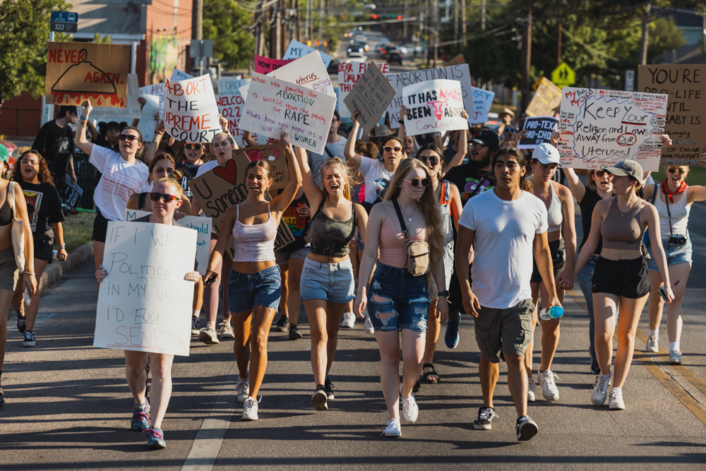 Abortion-rights activists march through Austin on June 26. (Jordan Vonderhaar for The Texas Tribune)