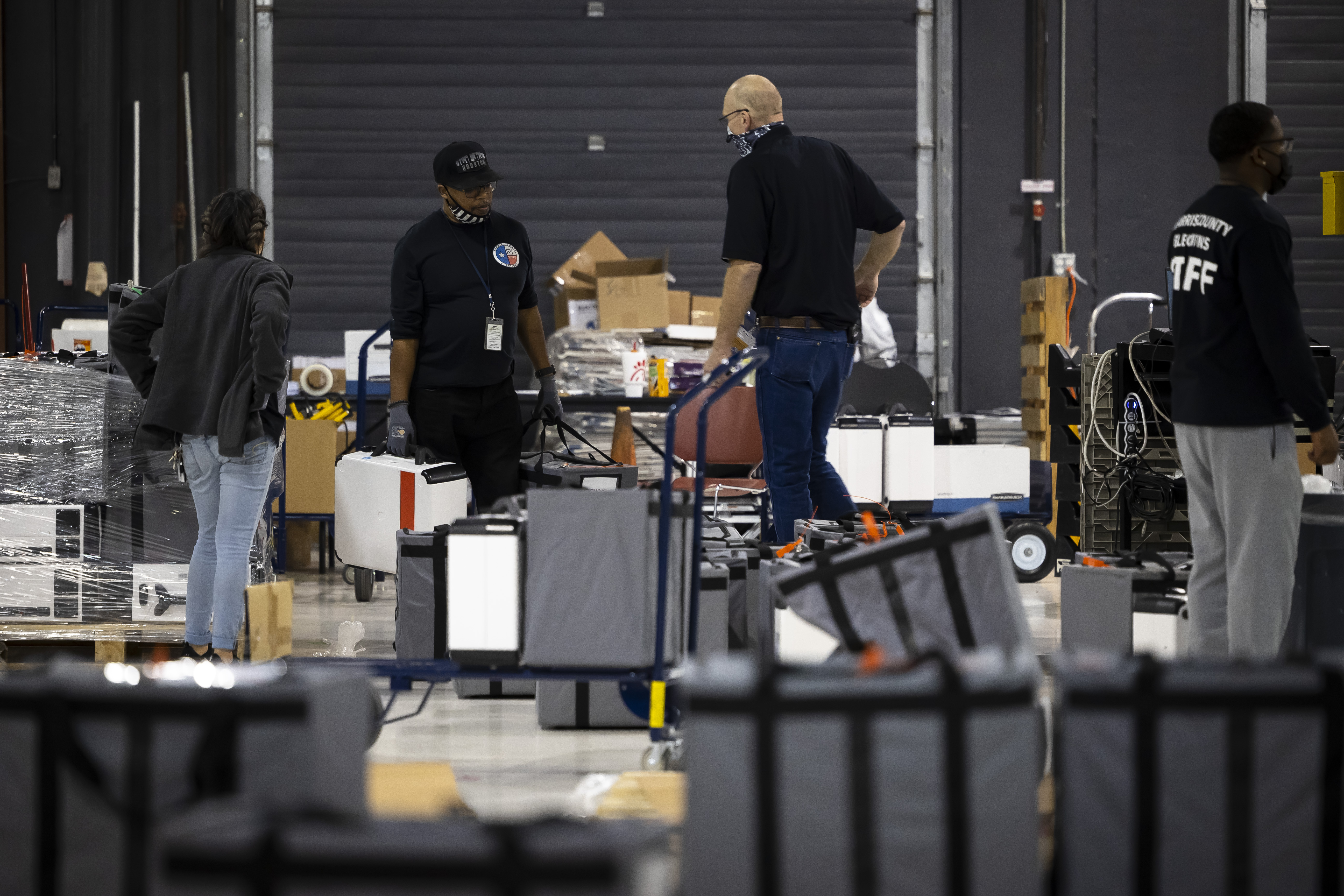 Harris County Elections Staff members sort ballot bags at <a href=