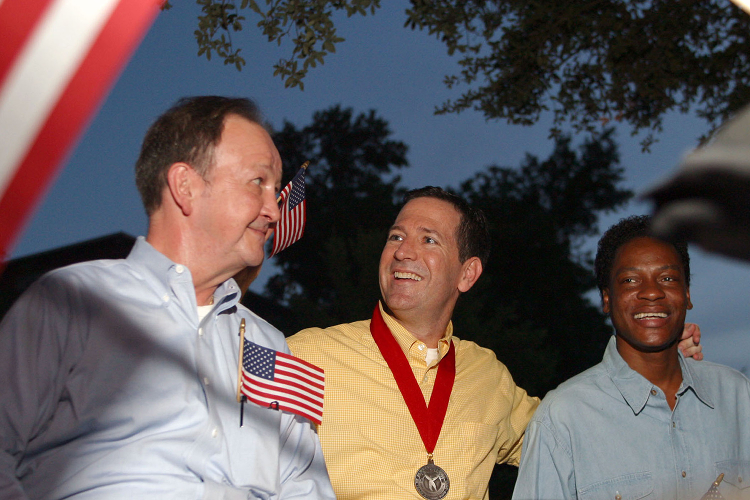 Left to right: John Lawrence, Attorney Mitchell Katine and Tyron Garner celebrate the recent landmark Supreme Court ruling on a Texas sodomy law, during a gay pride parade in Houston on June 28, 2003.