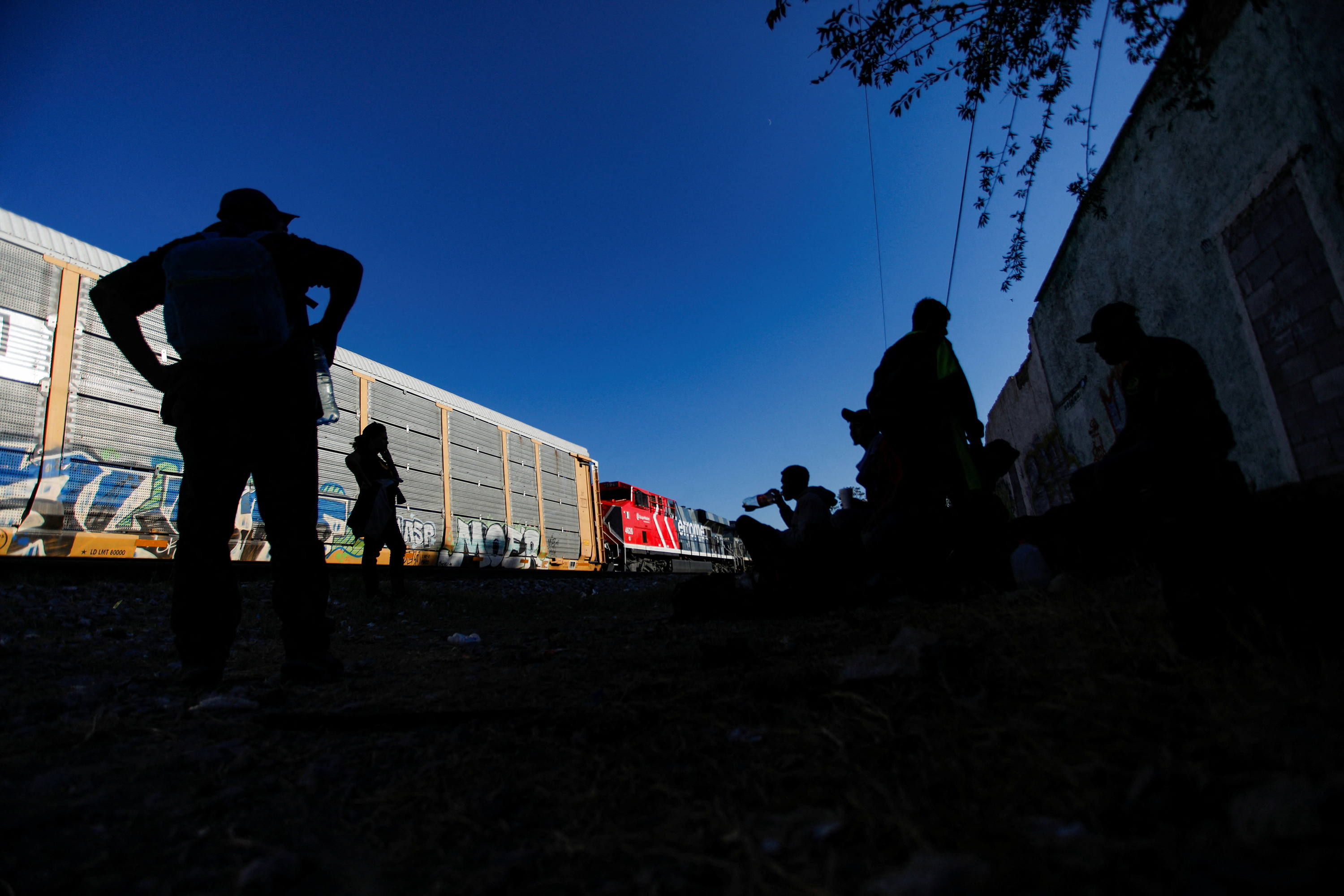 Venezuelan migrants wait to board a train to try to reach the U.S. border as they travel through the state of Coahuila, in Ramos Arizpe, Mexico on Sept. 20, 2023.